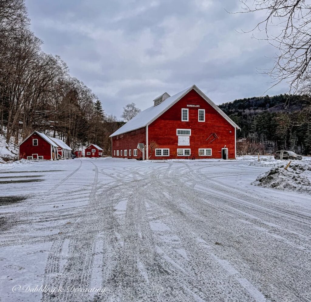 Quechee Inn at Marshland Farm large red barn during winter's snow.