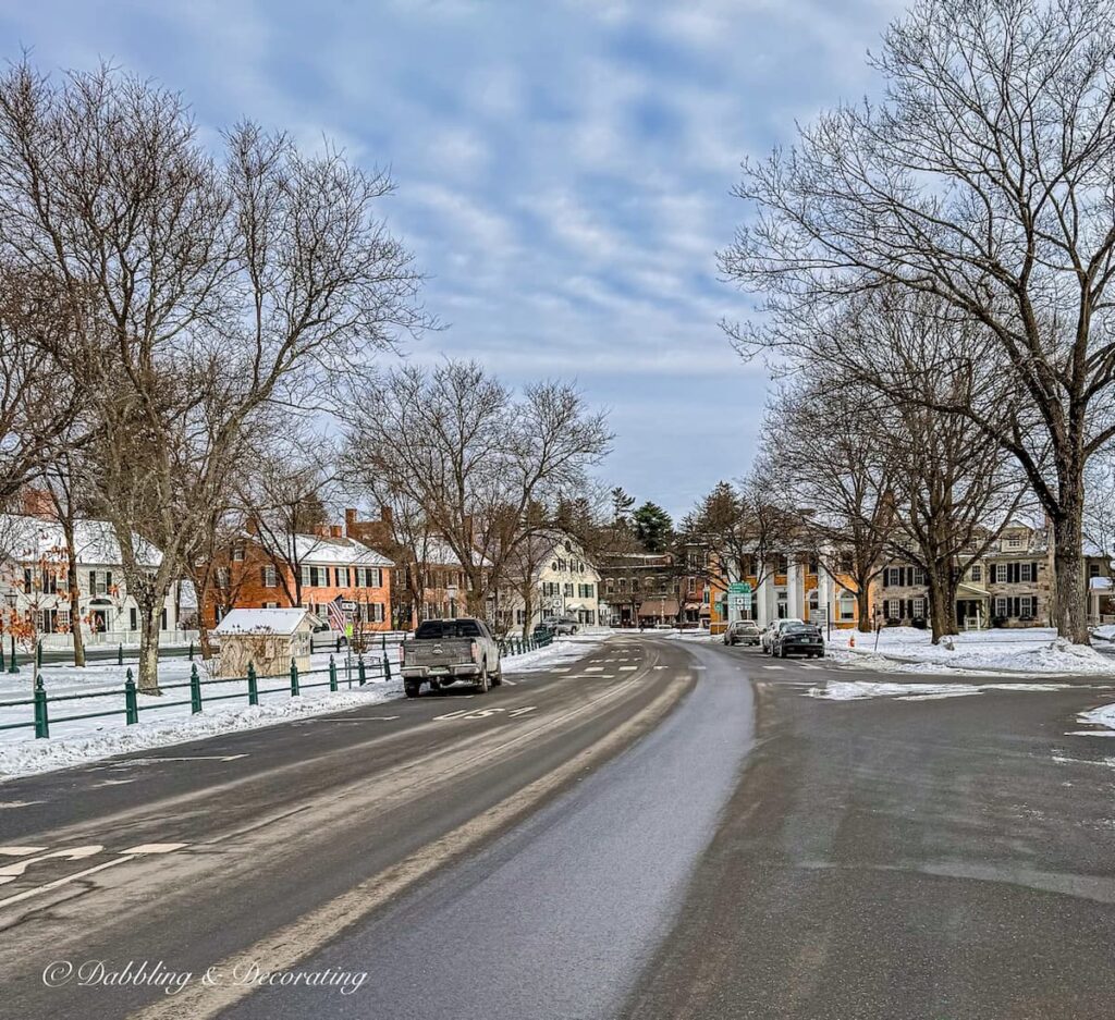 Road entering into Woodstock, Vermont during winter's snow.