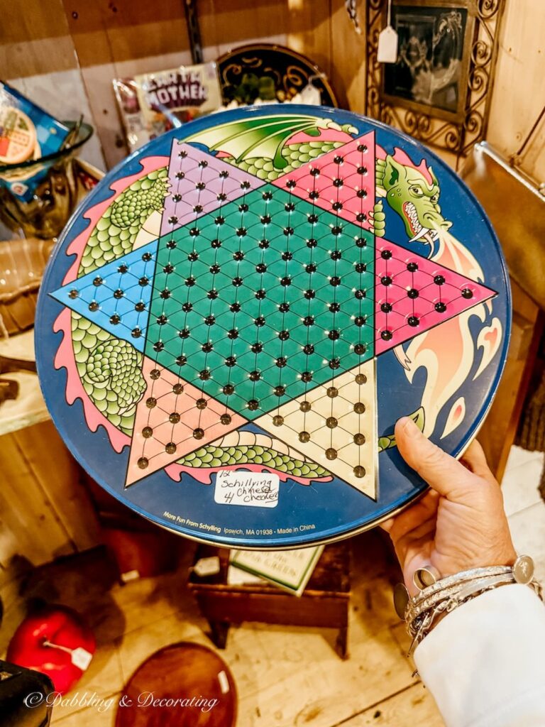 Chinese marble board in hand at antique store for apres ski decor ideas.