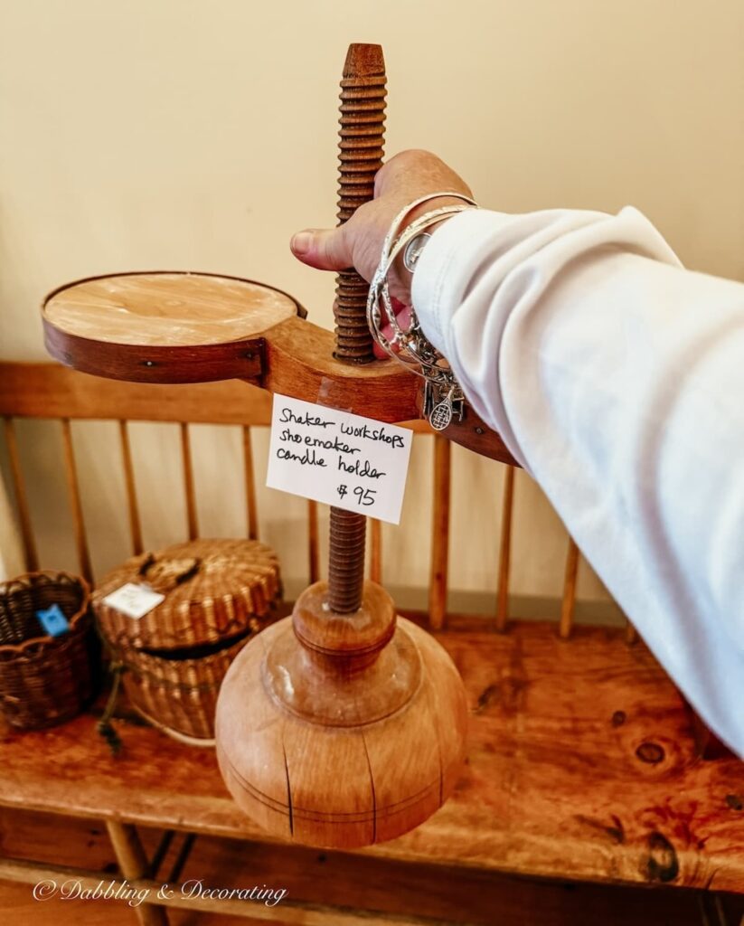 Shaker workshops shoemaker candleholder in hand at estate sale with $95 price tag.