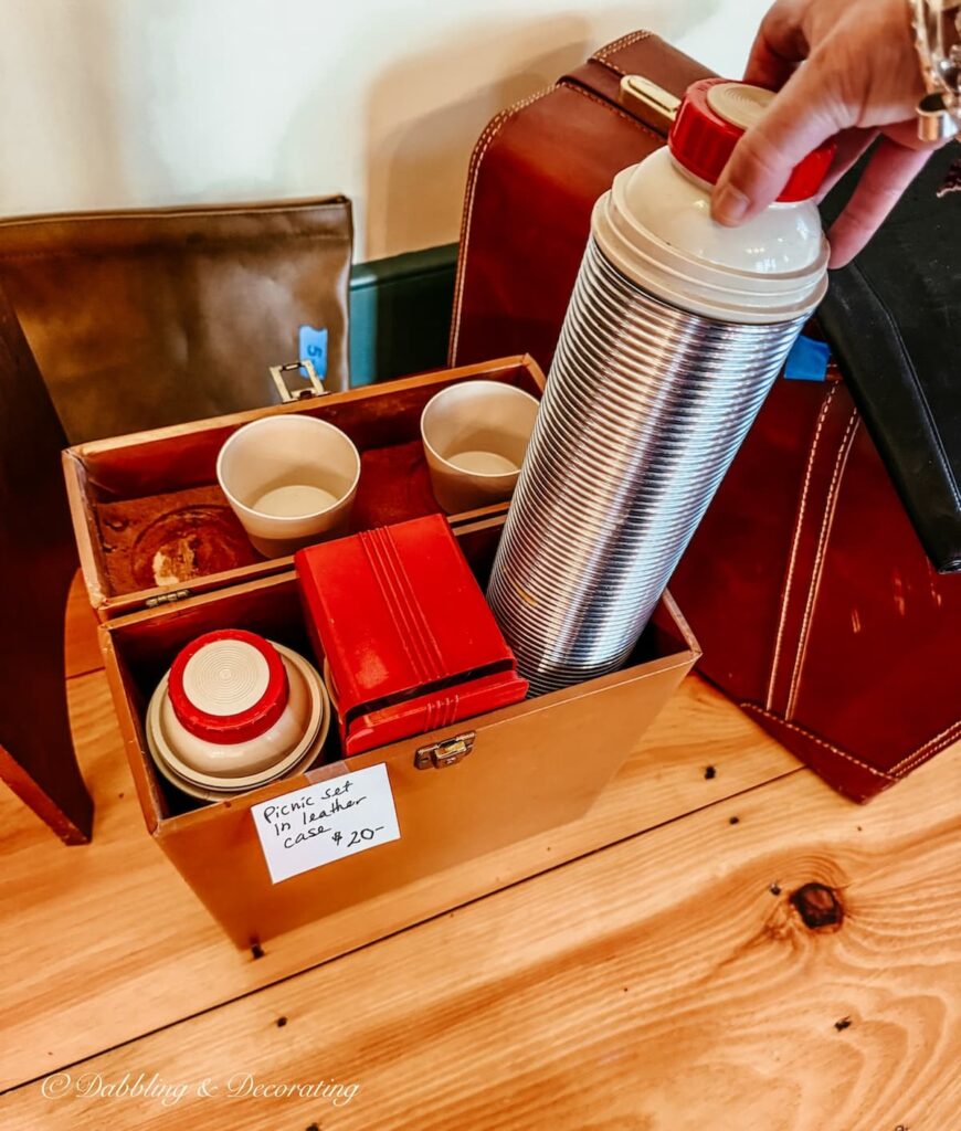 Vintage leather case picnic set with two silver thermoses at a high end estate sale in Vermont.