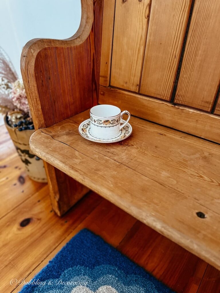Church pew bench entryway with Ainsley teacup.