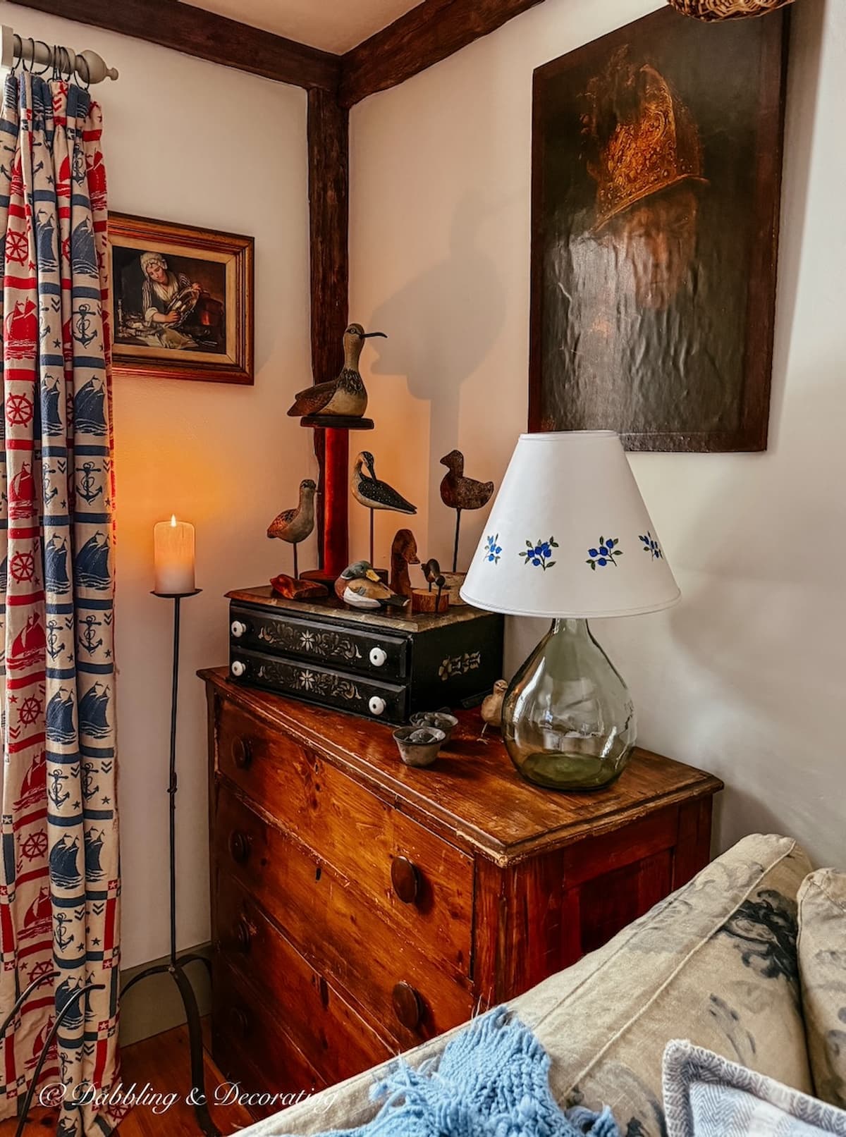 Antique styled living room corner with antique wooden dresser, driftwood bird collection and coastal drapes for a Sunday home vibe.