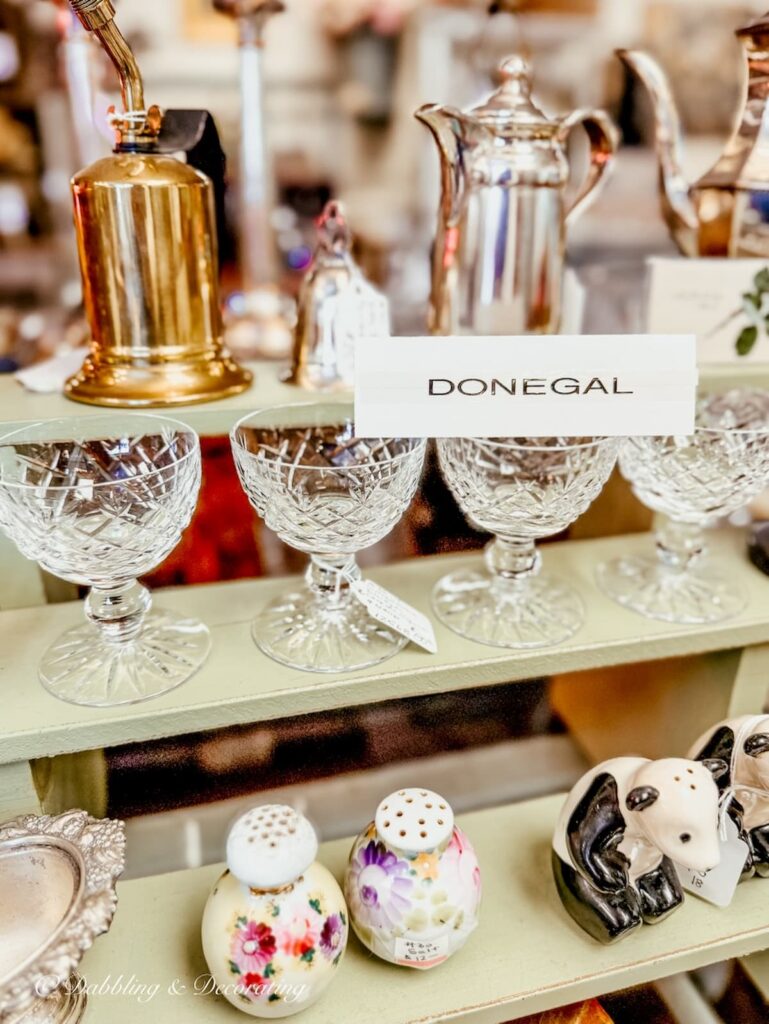 Set of Donegal glasses in antique store for St. Patrick's Day decor ideas.
