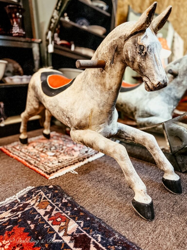 Antique wooden white horse jumping on display at Waverly Square Antiques in Ballston, Spa, NY.