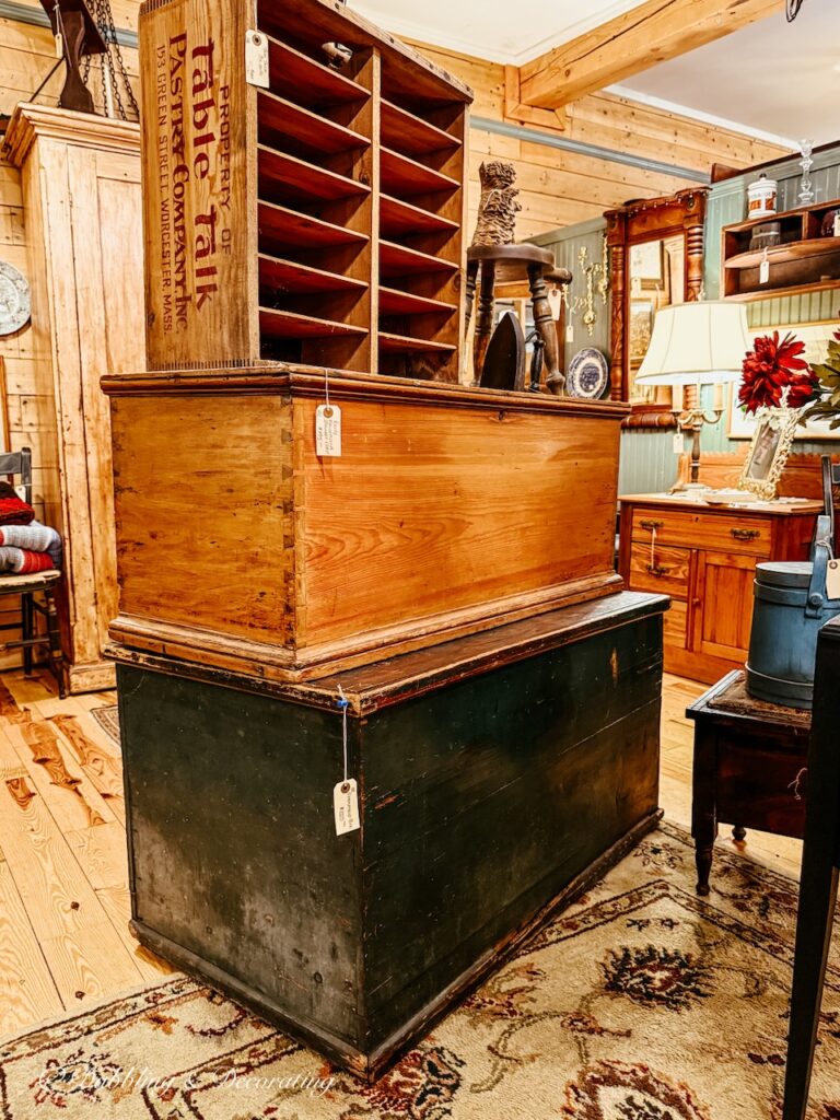 Two stacked antique trunks with wooden pie racked antiquing at Waverly Square antiques in Saratoga Springs, NY.