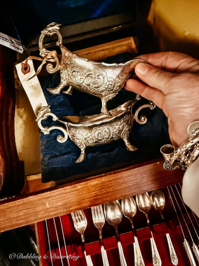 Two sterling silver creamers and sugar set antiquing in Saratoga Springs.