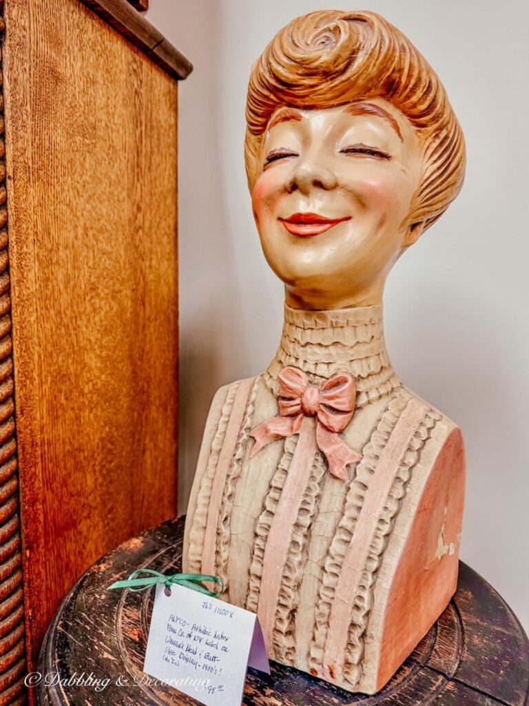 Well dressed lady mannequin antiquing in Saratoga Springs, NY.