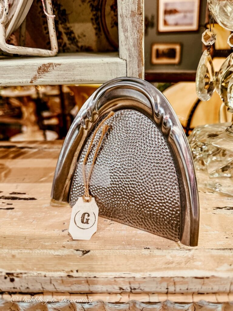 Silver crumb collector antiquing in Saratoga Springs.