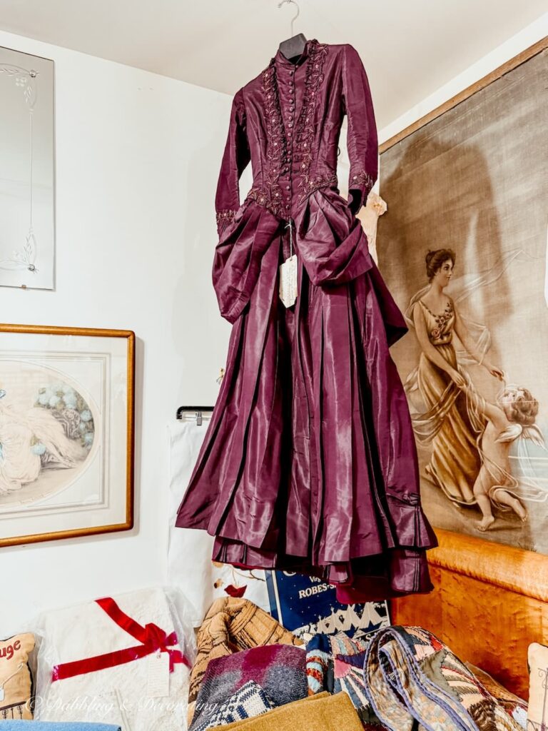 Gilded age purple taffeta dress on display at Stone Soup Antiques in Saratoga Springs, NY.