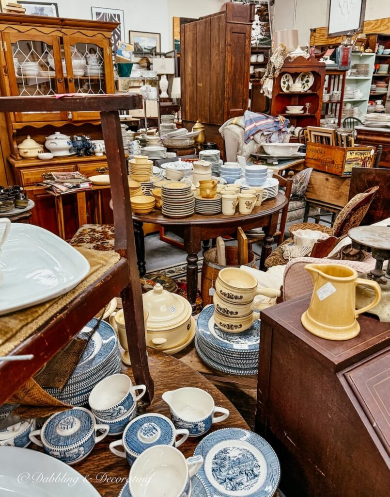 Vintage vendor booth at Eagle Bridge Antiques filled with vintage Phaltzcraft dishes.