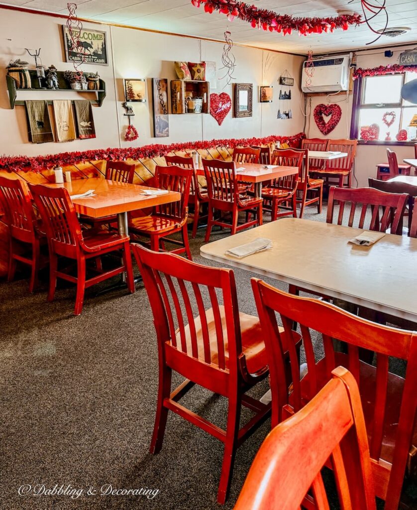 Inside seating with red chairs and tables at Benson's Family Restaurant in Eagle Bridge,New York.