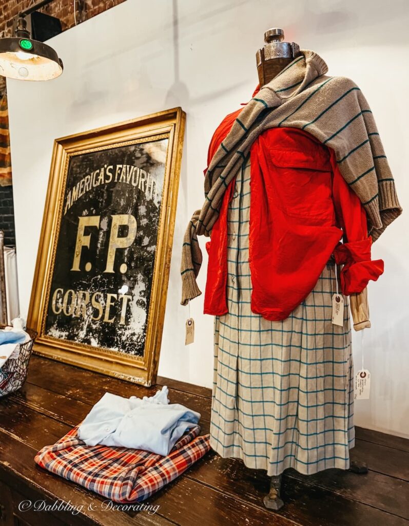 Styled female mannequin with clothing inside Open House Portland Maine vintage shopping.