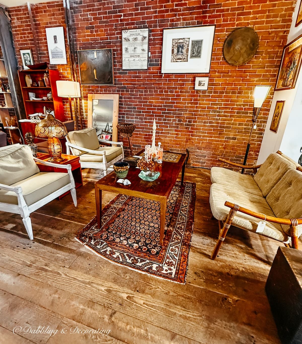 Inside a vendor booth display at Open House Vintage Market in Portland, Maine with mid century modern furniture and decor, beautifully styled.