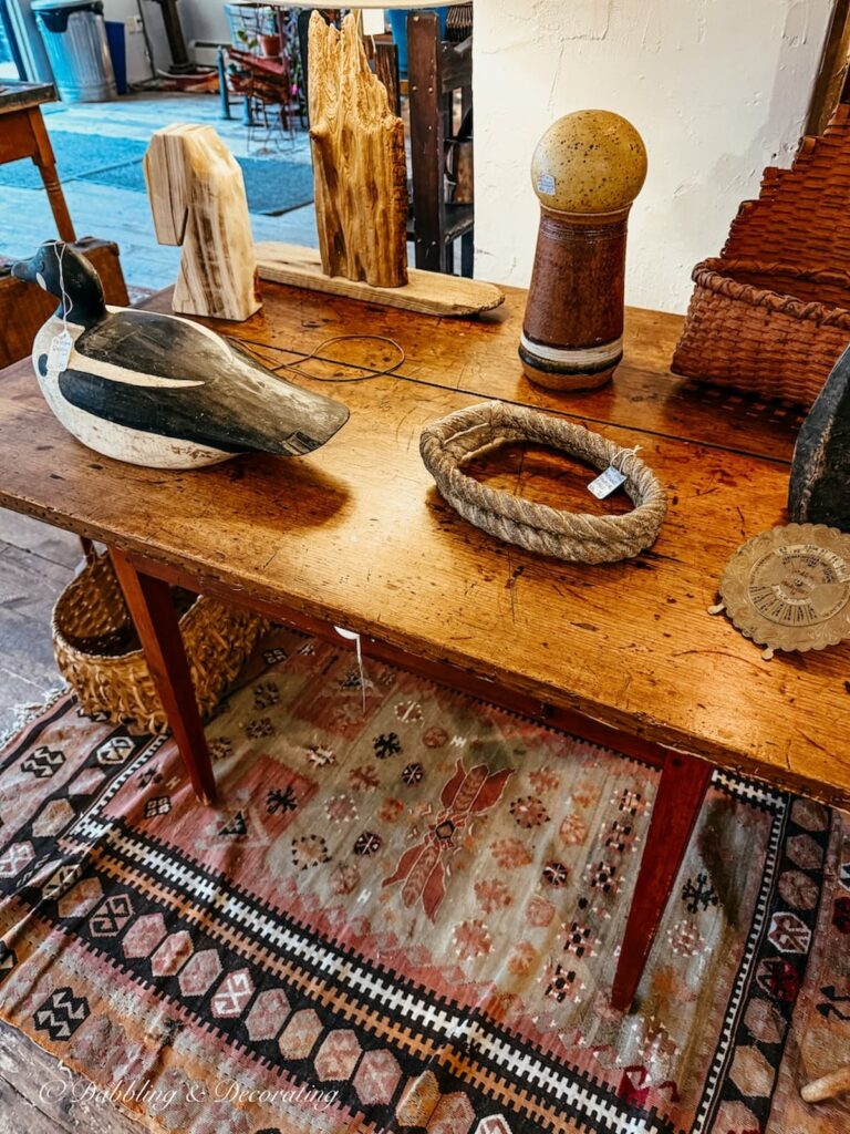 Antique table with antique wooden finds at Open House Portland, Maine.