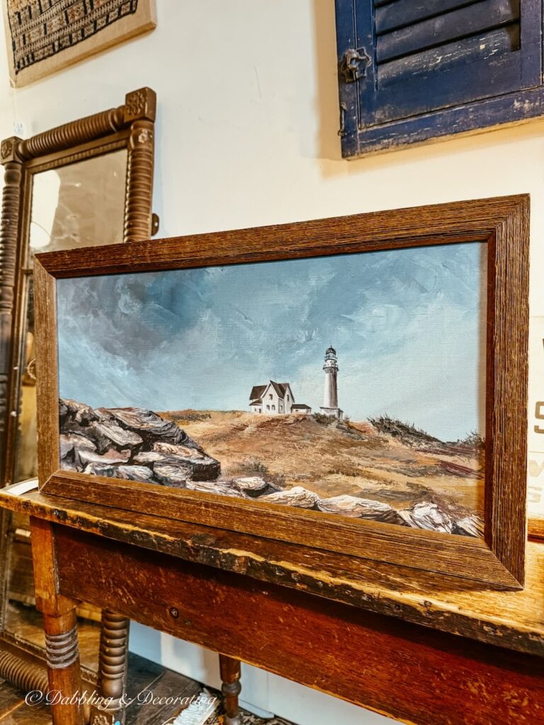 Coastal Maine landscape coastal painting with lighthouse and wooden frame.