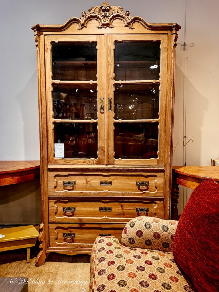 Vintage pine hutch with glass doors and drawers in antique store while looking for a cabinet for a Scullery-Inspired Kitchen Workroom in an open floor plan.