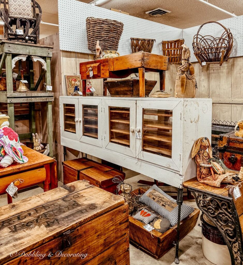 large long antique white pie safe with doors in antique store.