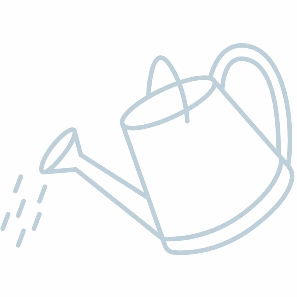 Graphic of a watering can tilted with water pouring out; Vintage Spring Decor Ideas