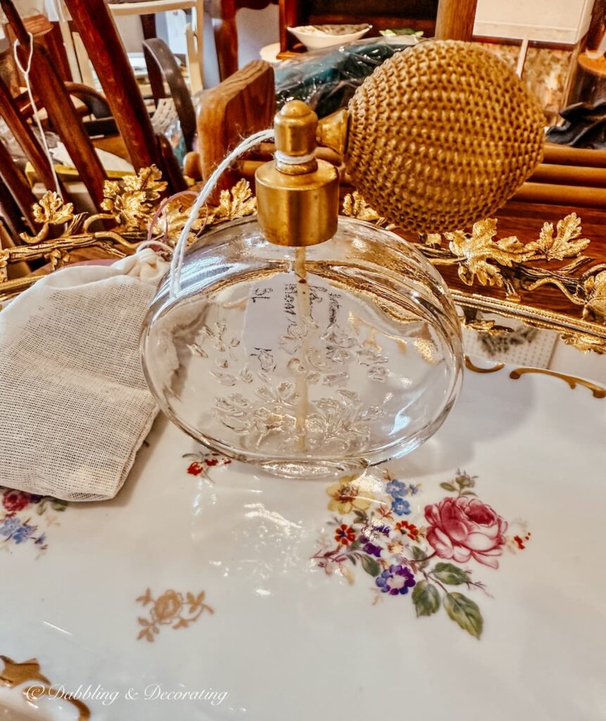 Antique atomizer in antique store for thrifted bougie decor ideas.