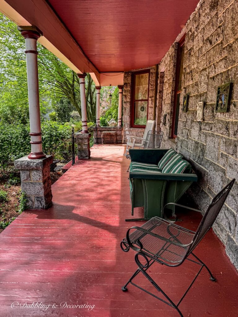 Outdoor covered large porch on bed & breakfast antiquing in Maryland.