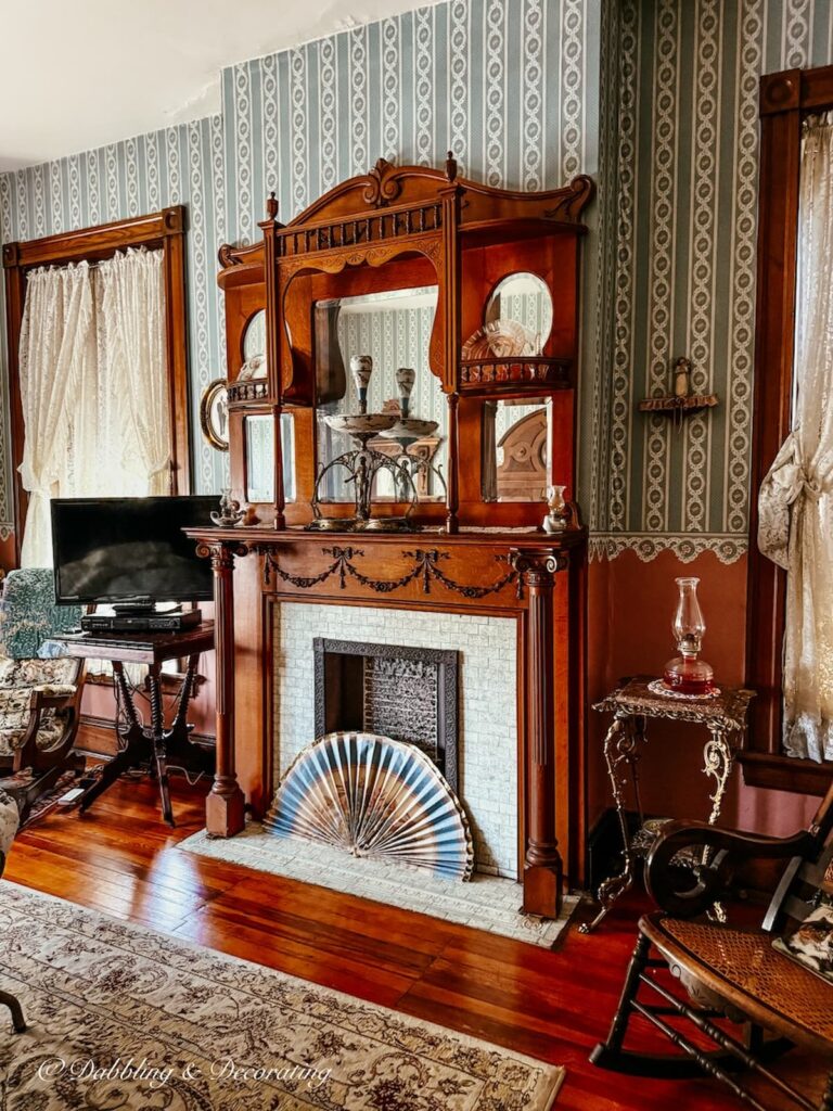 Inside the Spencer Silver Mansion Bed & Breakfast with a fireplace in bedroom while antiquing in Maryland.