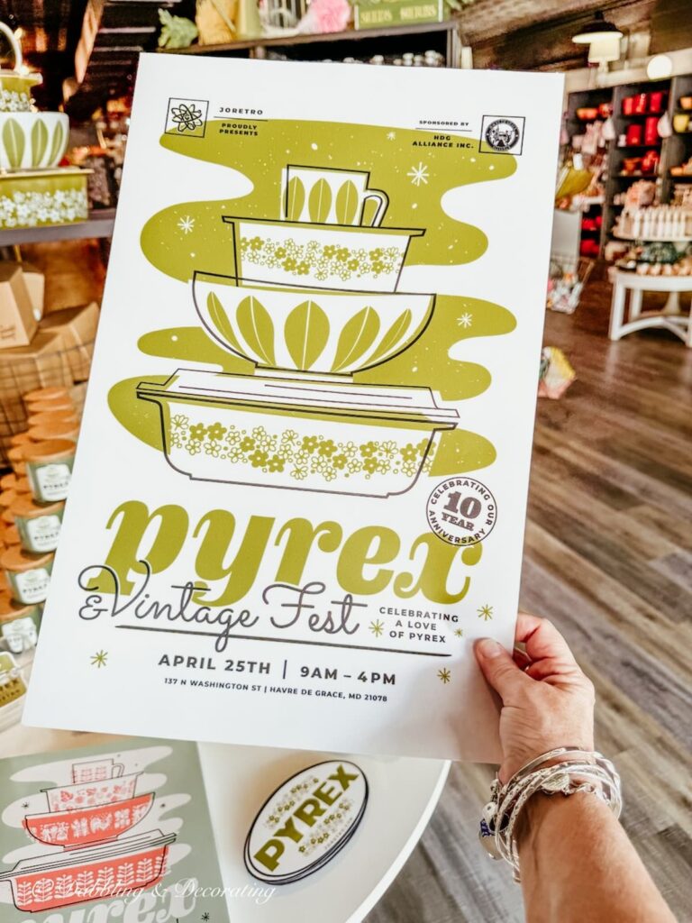 Pyrex vintage festival flyer in hand at RetroJo's in Maryland.