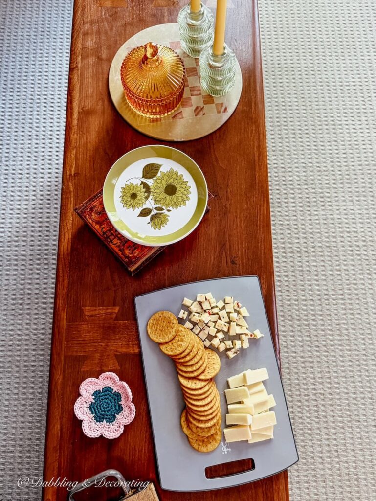 Mid century modern coffee table with appetizers displayed in townhouse.