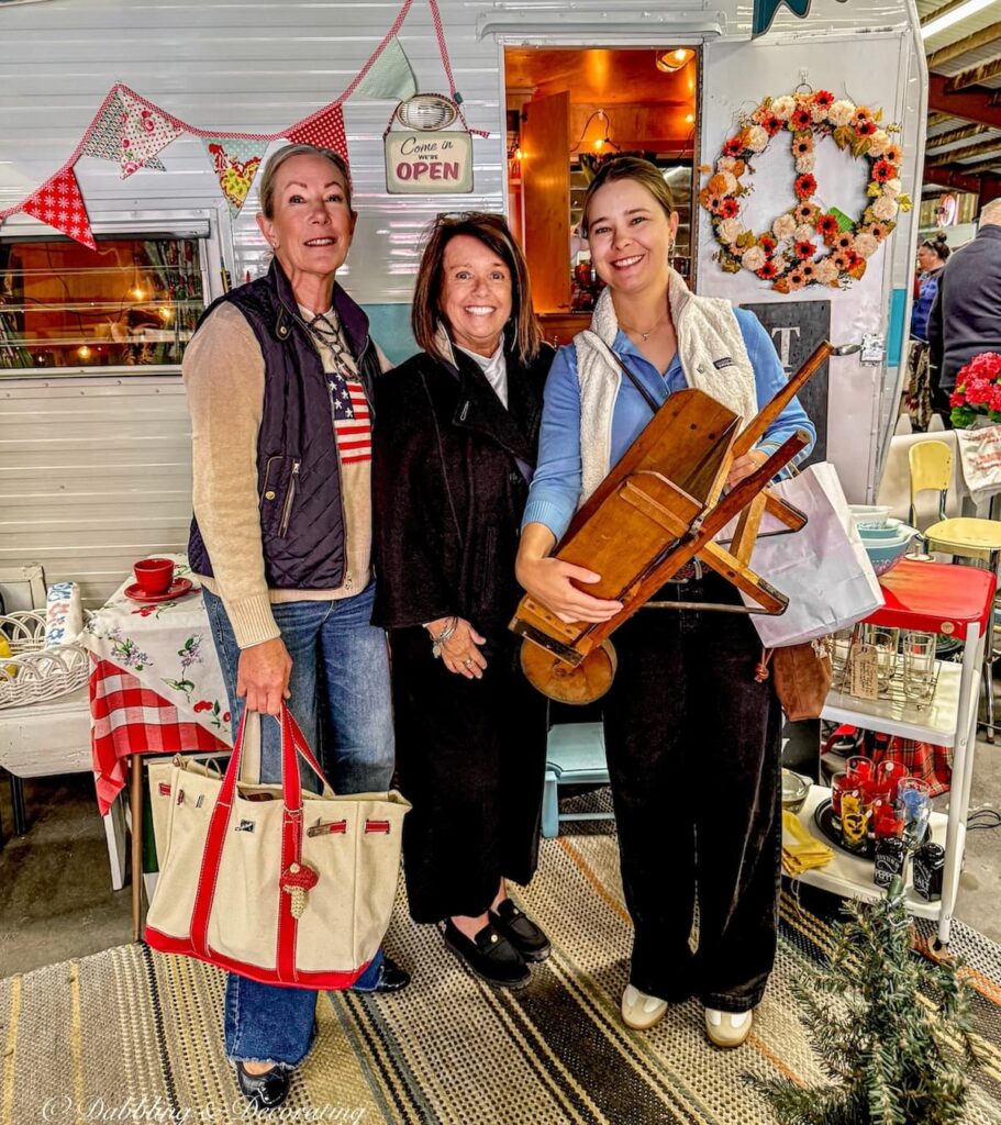 Three women antiquing at Vintage Market Days Vermont for how to style homes with vintage booth inspiration.
