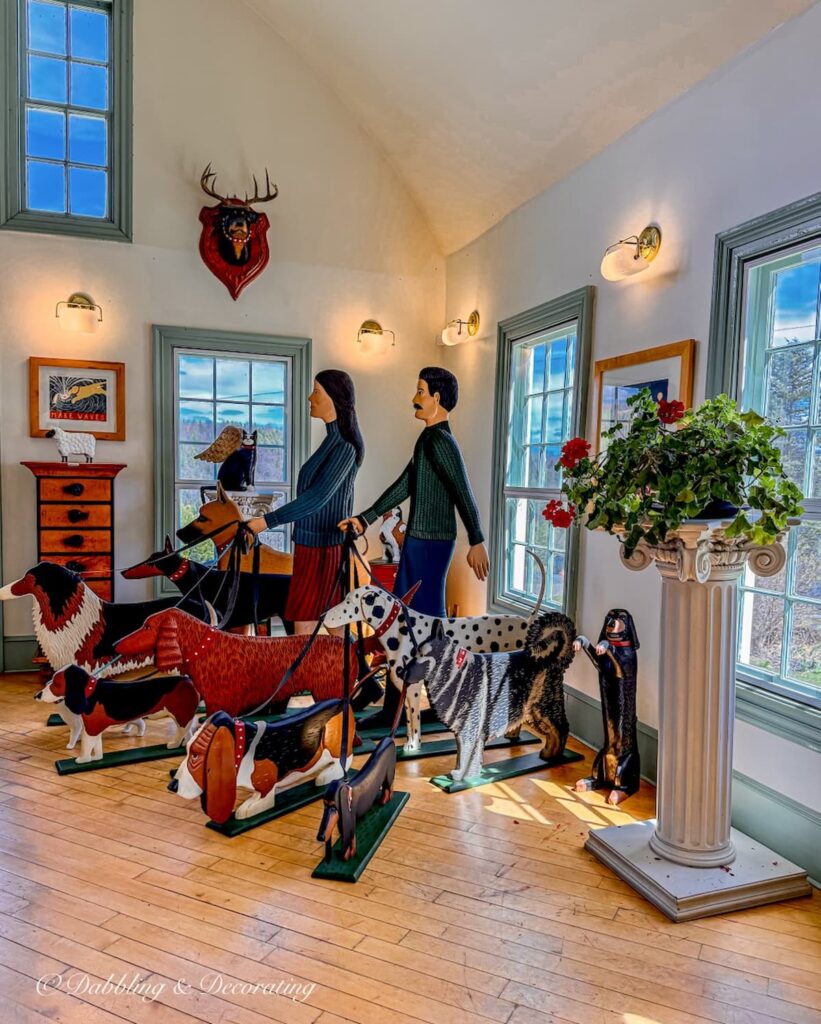 Inside the shop at Dog Mountain in St. Johnsbury, Vermont with life like statues walking dogs on leashes.