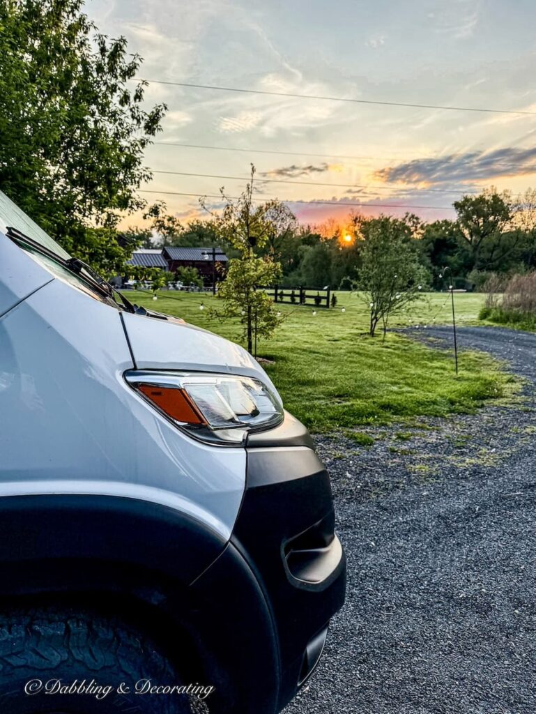 RV white Panoramic front end at sunset at Owl's Hoot Barn boondocking in Coxsackie, NY.
