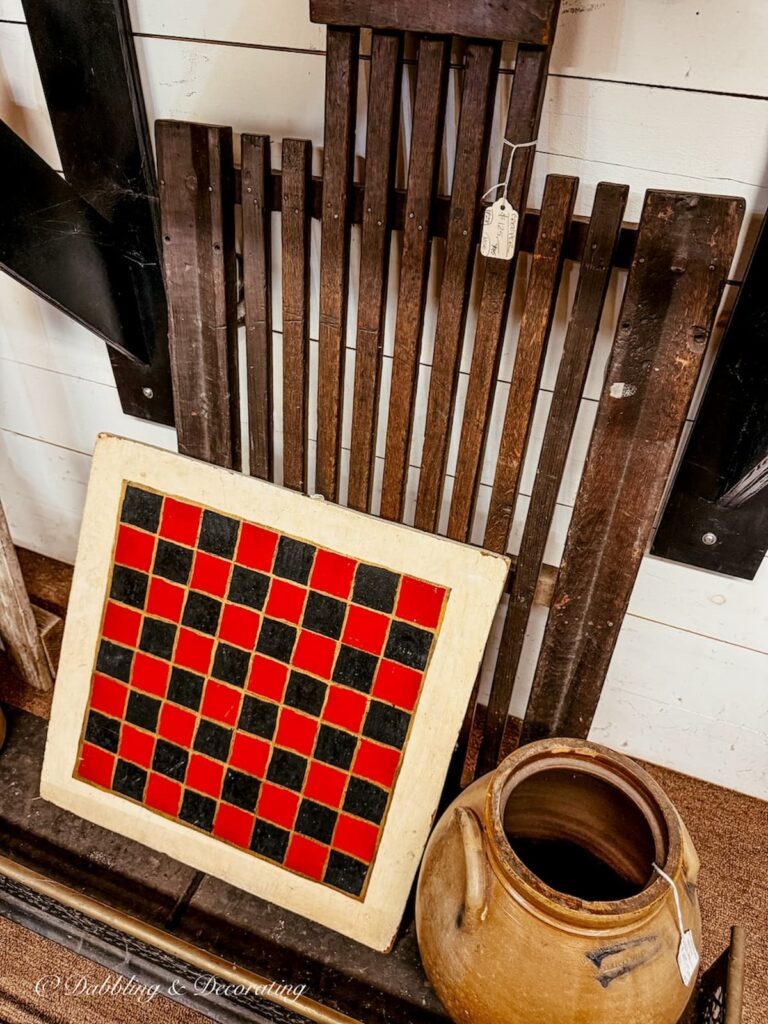 Red and black chess set inside antique store for heritage Americana decor ideas.
