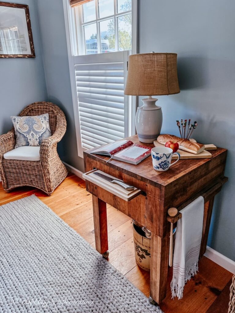 Vintage butcher block table styled in off kitchen scullery space in home.