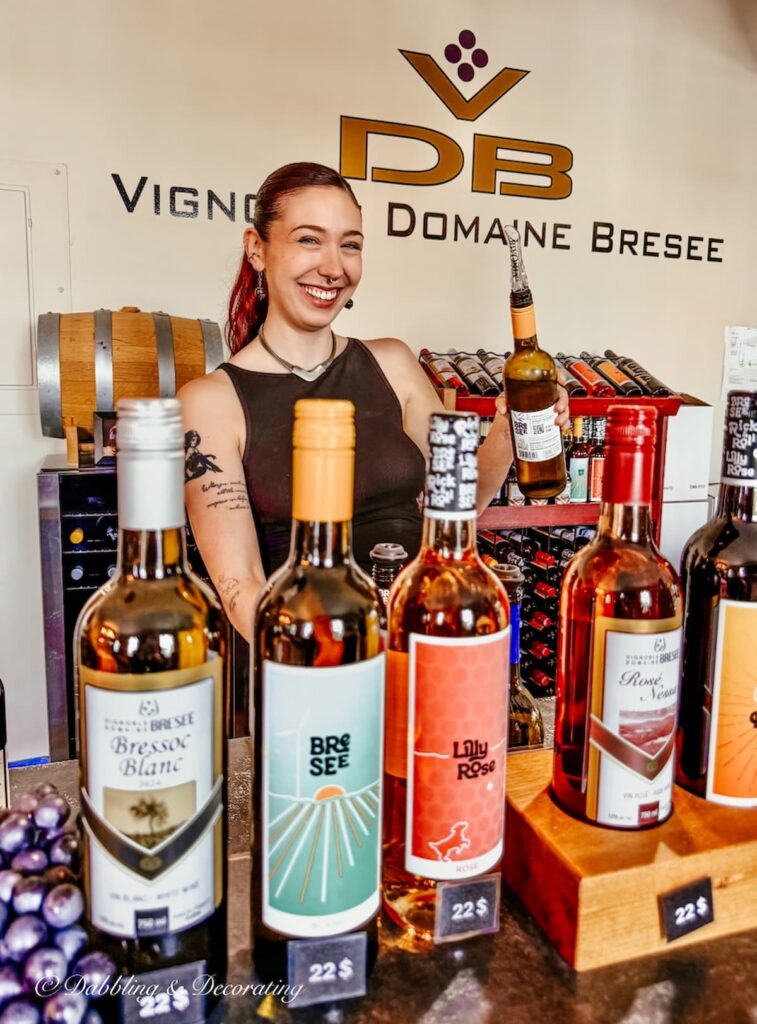 Zoe pouring wine at the Vignoble Domaine Bresee, Sutton, Quebec.