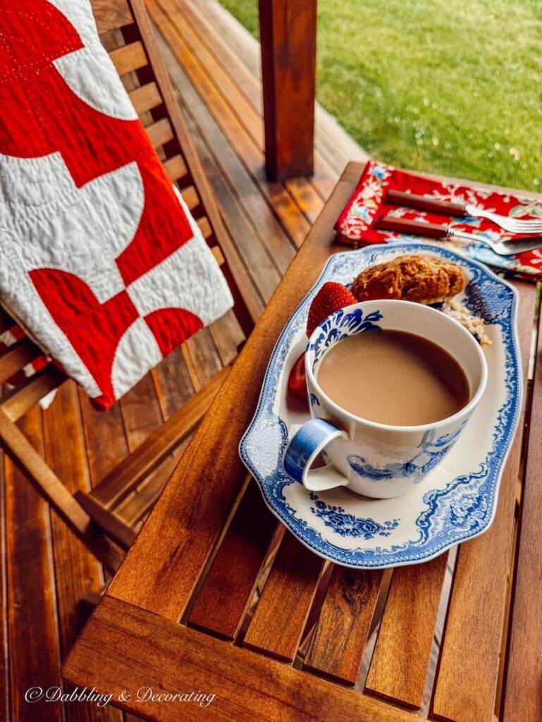 Johnson Brother's tea and toast plate with coffee mug on outdoor bistro table.