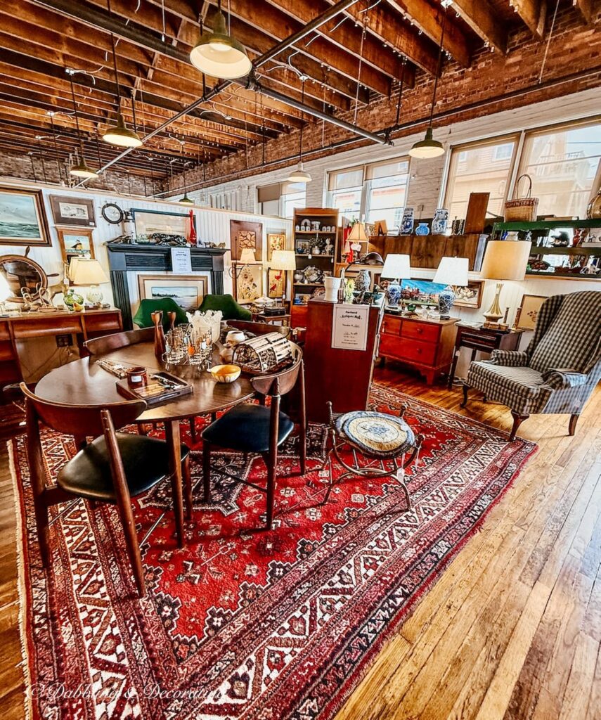 Large Turkish antique rug as the foundation of a large vintage booth at Portland Antique's Mall in Maine. Very Vintage Urban in style.