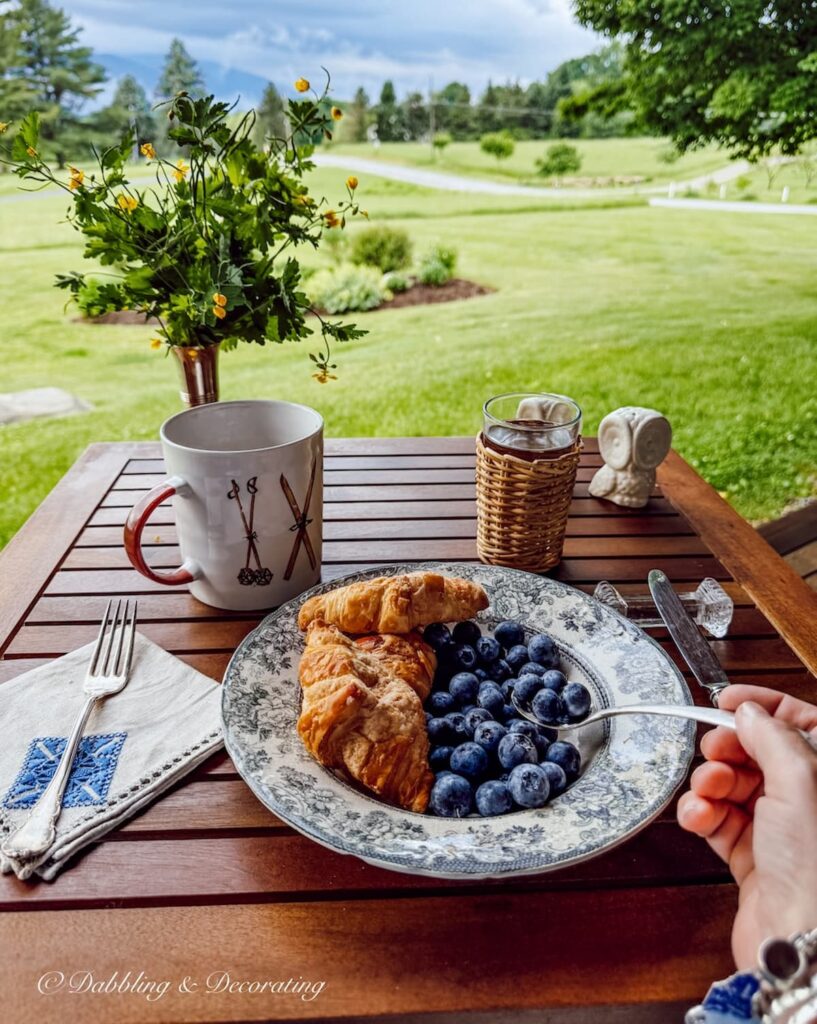 Breakfast table for one with mountain views on a stormy morning in Vermont.