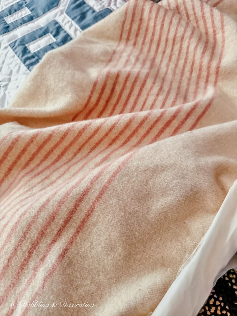 Vintage wool camp blanket with pink stripes found in my parents' attic.
