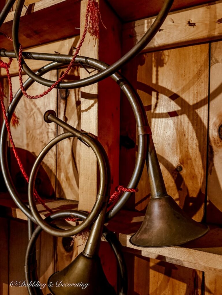 Antique horn collection hanging on unfinished wall in my parents' attic.
