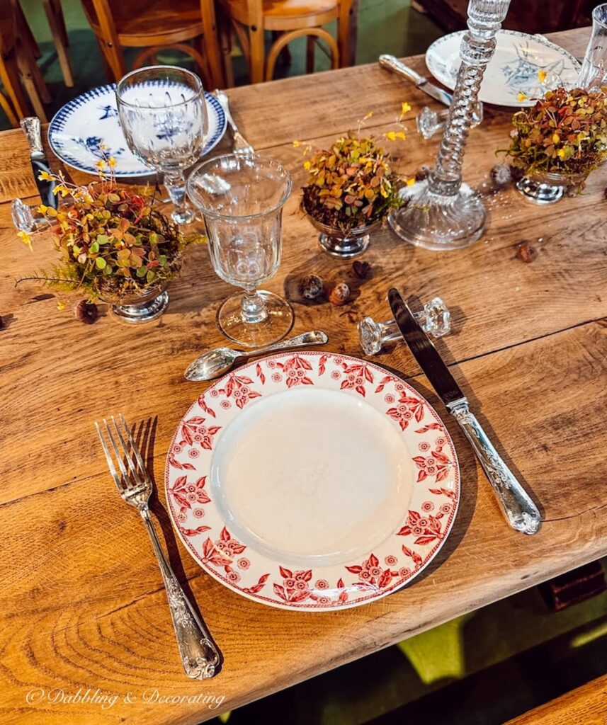 Fall place settings on antique store table display while antiquing in Paris.
