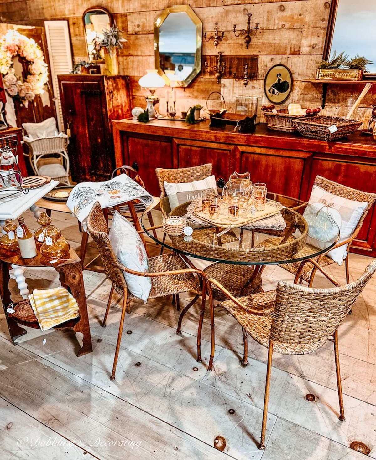 Fall vintage booth displays inside Breakaway Designs antique store in Maine. Gold, amber table setting ideas.