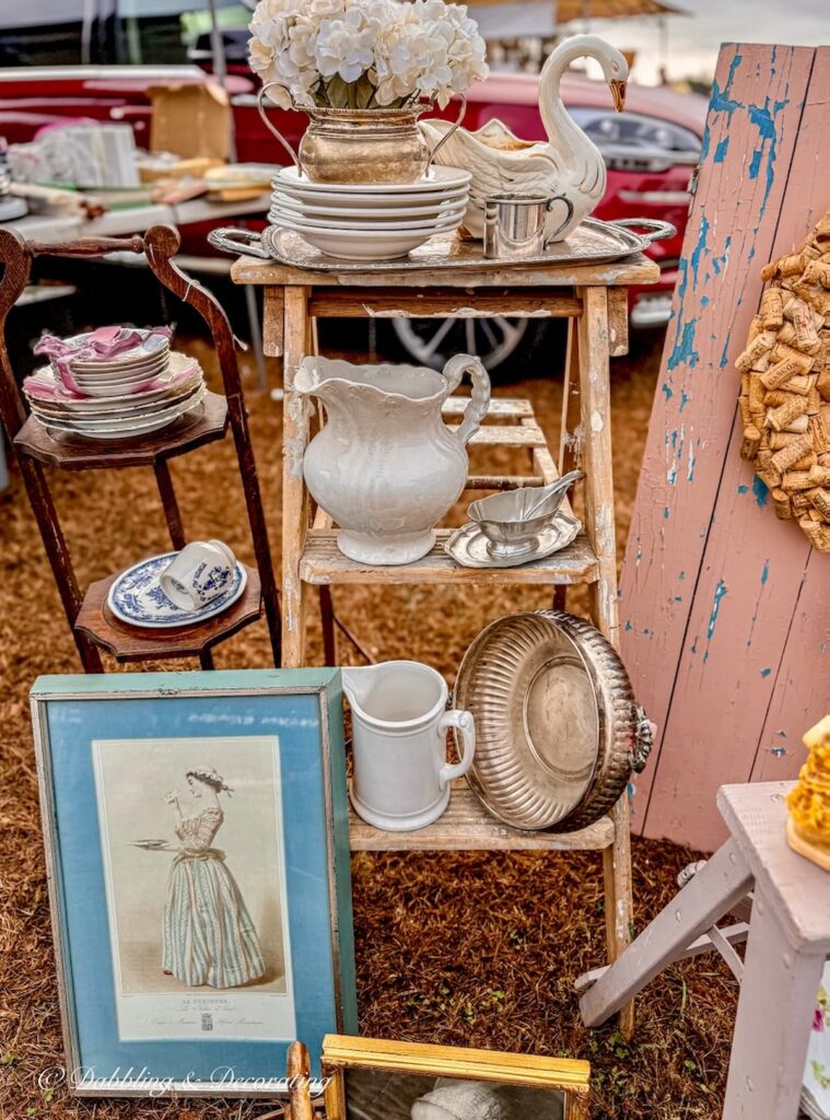 Vintage booth display with soft mauve and blue hues at the Elephant's Trunk Flea Market in Connecticut.