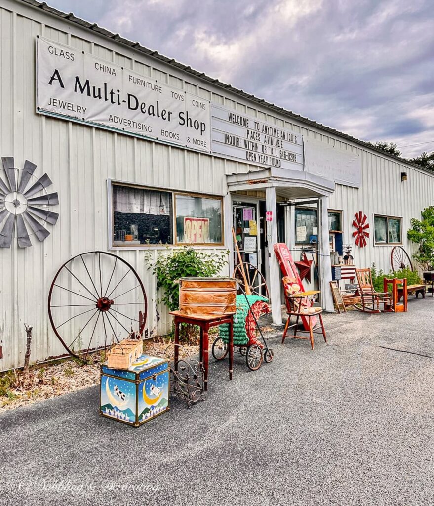 Antique store in Wells Maine with outdoor old wagon wheels on display.
