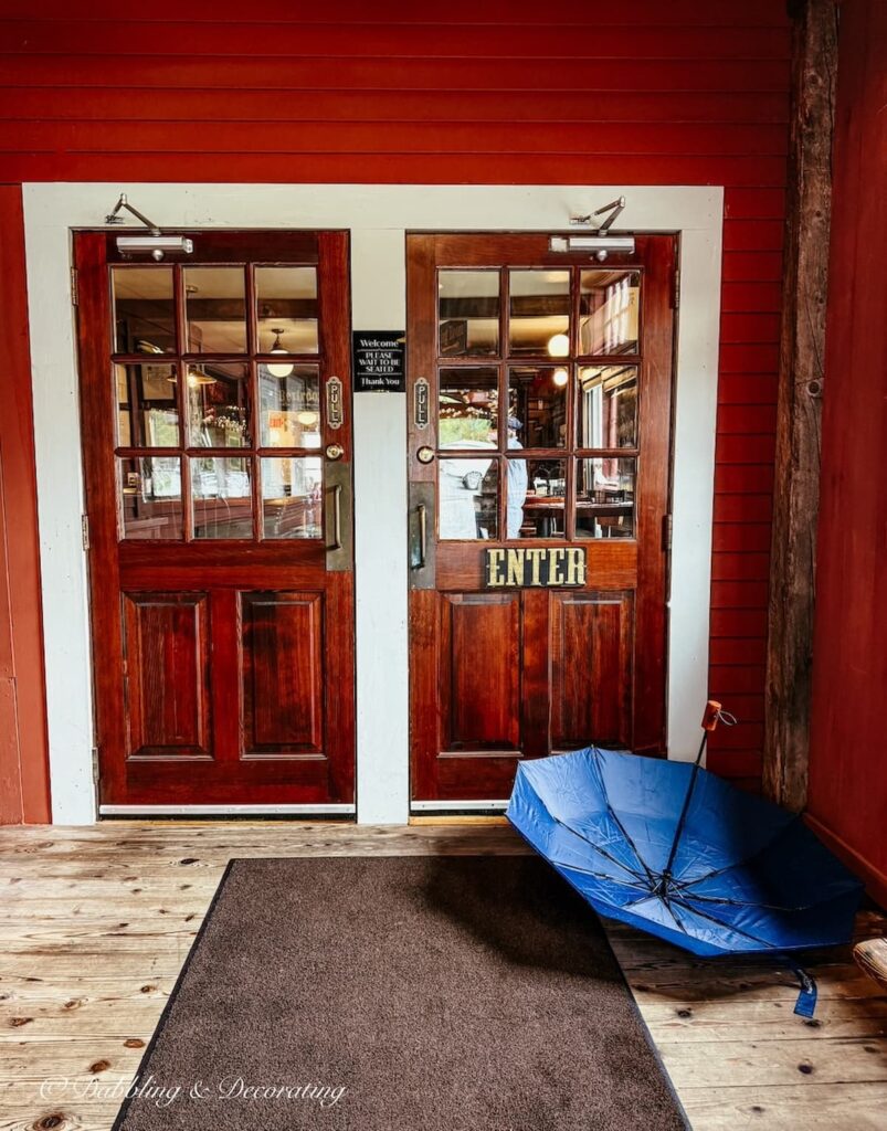 Outside Mildred's Table restaurant with an open umbrella resting at The Vermont Country Store.