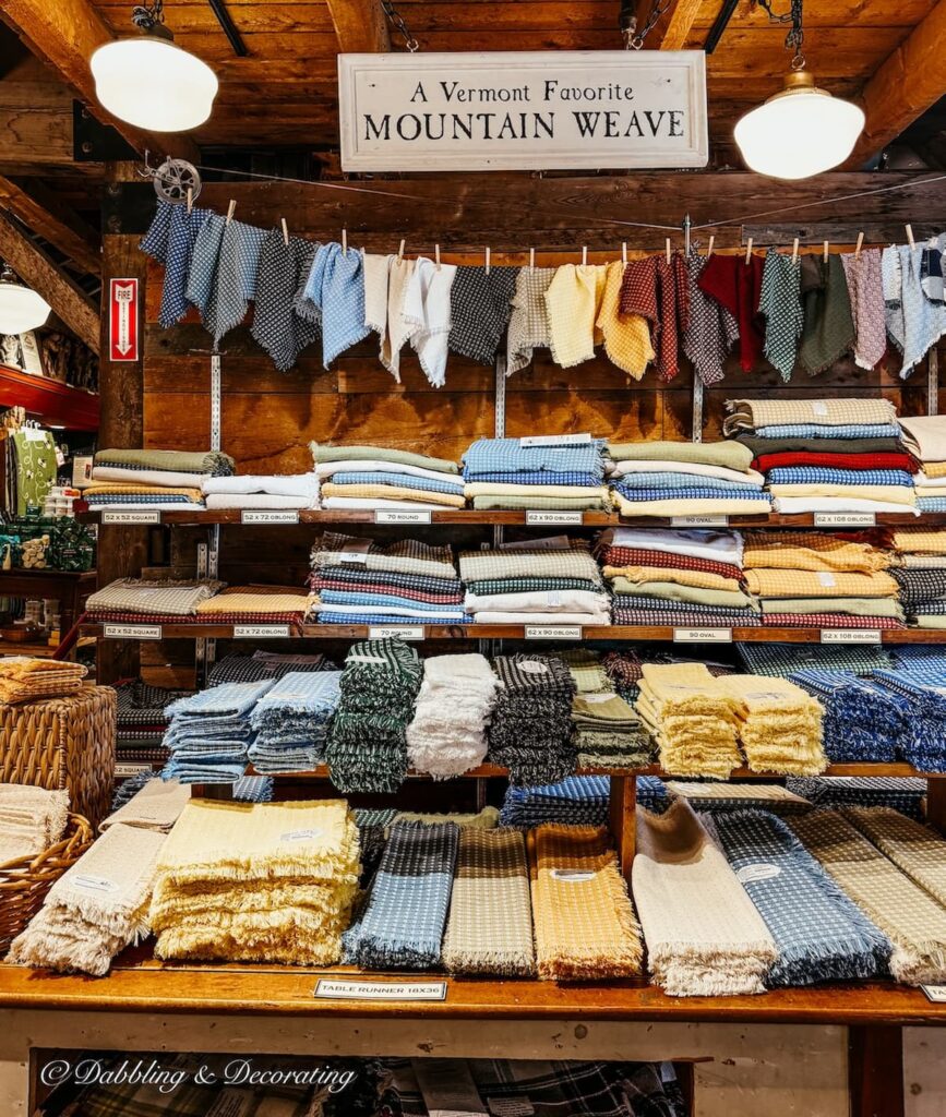 Display of Mountain Weaver tablecloths and linens at The Vermont Country Store.