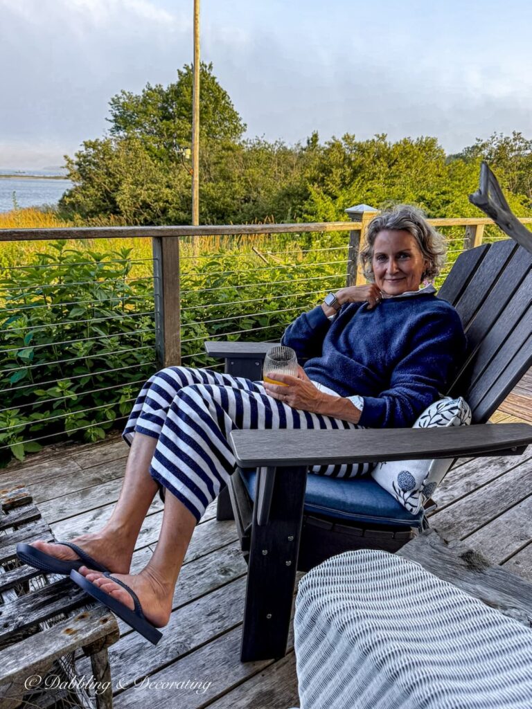 Molly in Maine sitting on her porch on a summer evening in Maine.