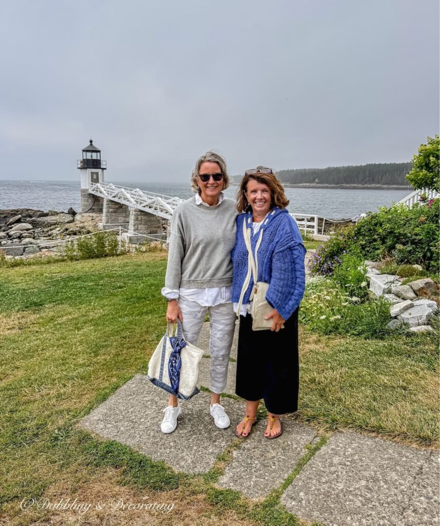 Ann and Molly in front of the Port Clyde Lighthouse in Maine.