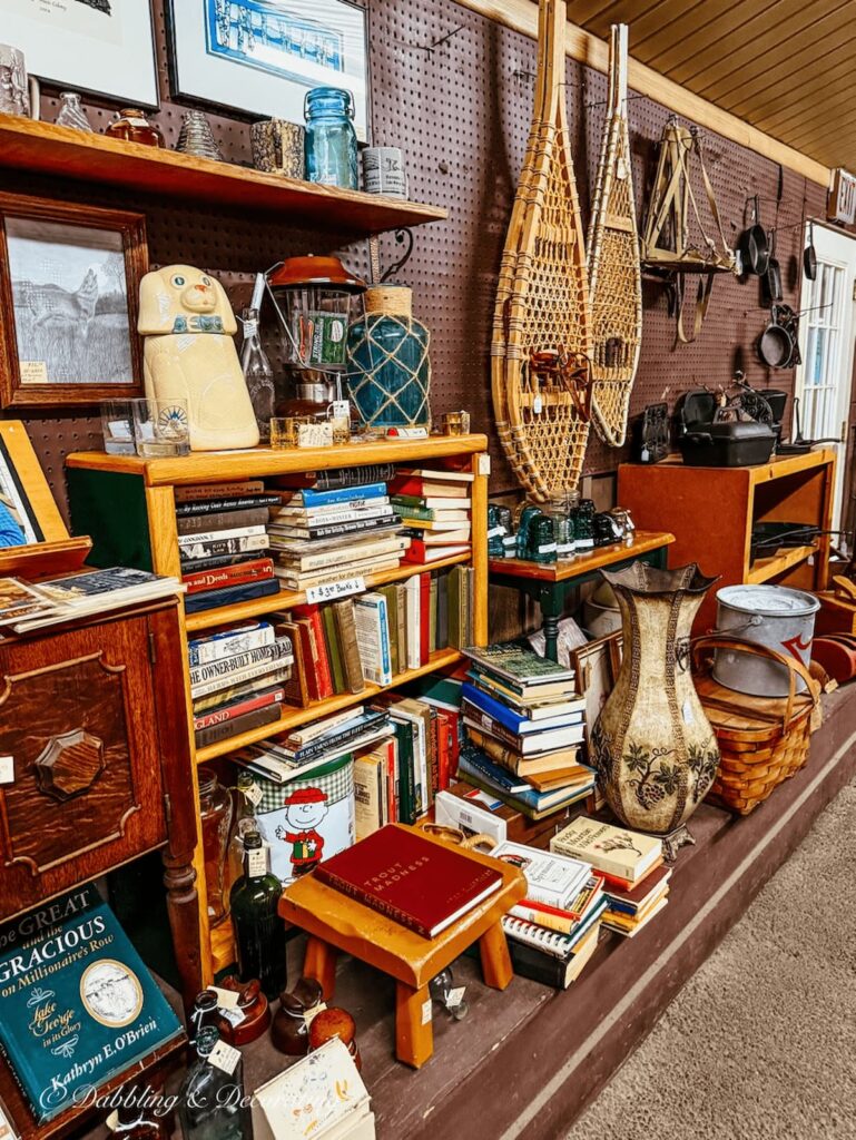 Antique Adirondack Lodge decor with snowshoes and camping gear at Hay Fields Antique Store in the Adirondacks.