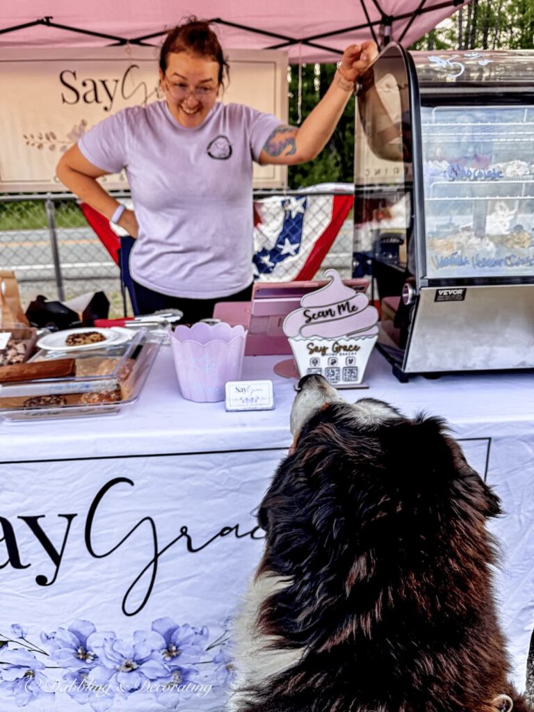 Ice cream stand with Ella, the Berner asking for a treat at Hay Fields Antique's Band stand with music at Hay Fields Antiques in the Adirondacks during Music, Munchies, and Motors Mondays.