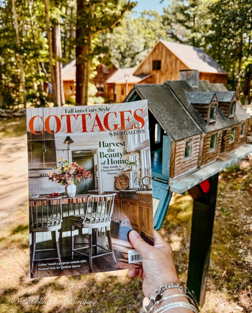 Cottages & Bungalows fall magazine in hand removing it from custom mailbox at home in Maine featuring Dabbling & Decorating